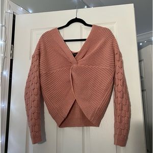 Pink sweater with knot in front